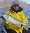 Cat Eye Outfitter and a Greenback Walleye fish